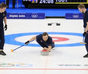 epa09770842 Oskar Eriksson of Sweden in action during Men's Curling gold medal match between Sweden and Great Britain at the Beijing 2022 Olympic Games, Beijing,  19 February 2022.  EPA/ALEX PLAVEVSKI