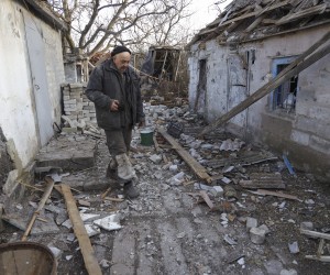 epa09774802 Local resident Valery walks around a damaged homestead as a result of shelling in Tamarchuk village near Marinka not far from pro-Russian militants controlled city of Donetsk, Ukraine, 20 February 2022. Tamarchuk only has 15 local residents and it is placed in a ‘grey zone’ between Ukraine and Pro-Russian militants. There are no Ukraine troops in the village but it has been getting shelled by militants for three days in a row. The last shelling was on 9 am on 20 February.  EPA/STANISLAV KOZLIUK  ATTENTION: This Image is part of a PHOTO SET
