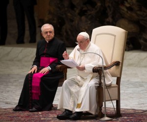 epa09778135 Pope Francis, sitting next to Italian priest Monsignor Leonardo Sapienza (L), delivers a speech during the weekly general audience in the Paul VI Audience Hall, in Vatican City, 23 February 2022.  EPA/MAURIZIO BRAMBATTI