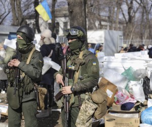 epa09789254 Ukrainian servicemen patrol the city of Dnipro, Ukraine, 27 February 2022. Russian troops entered Ukraine on 24 February prompting the country's president to declare martial law.  EPA/STANISLAV KOZLIUK