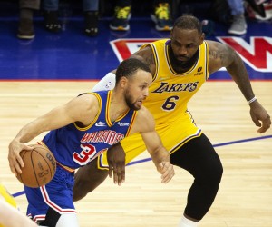 epa09751491 Golden State Warriors guard Stephen Curry (L) drives past Los Angeles Lakers forward LeBron James (R) during the second half of their NBA game at Chase Center in San Francisco, California, USA, 12 February 2022.  EPA/D. ROSS CAMERON  SHUTTERSTOCK OUT