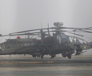 epa09780381 US military Apache attack helicopters AH-64 are seen during a technical stop on the tarmac at Traian Vuia international airport of Timisoara city, north-west of Bucharest, Romania, 24 February 2022. The five helicopters were being deployed from the NATO Multinational Brigade South-East, based in Craiova city towards a base in Hungary. The United States is committed to strengthen its Eastern flank NATO allies' defense capabilities following Russia's military operation in Ukraine. Russian troops entered Ukraine on 24 February.  EPA/SEBASTIAN TATARU