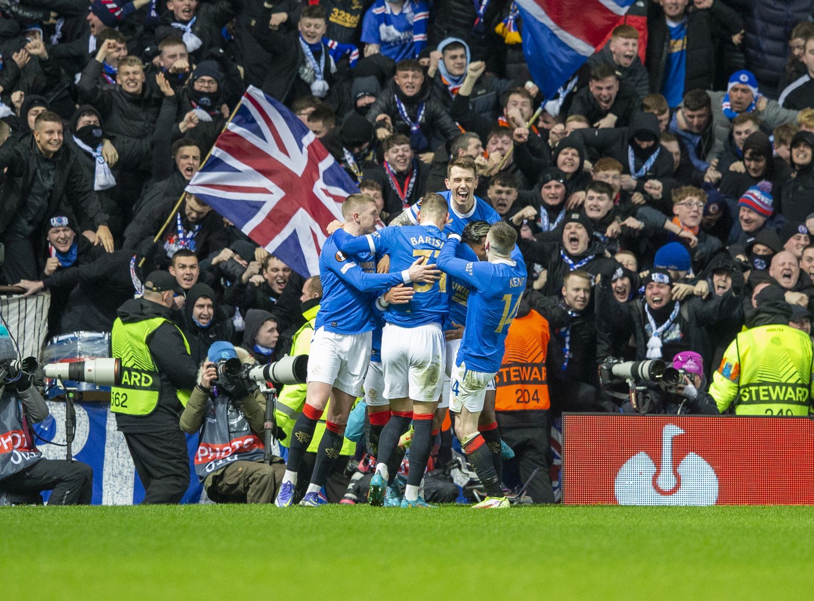 epa09782762 Rangers celebrate after scoring a penalty by James Tavernier during the UEFA Europa League playoff soccer match between Glasgow Rangers FC and Borussia Dortmund at Ibrox Stadium, in Glasgow, Scotland, 24 February 2022.  EPA/ROBERT PERRY