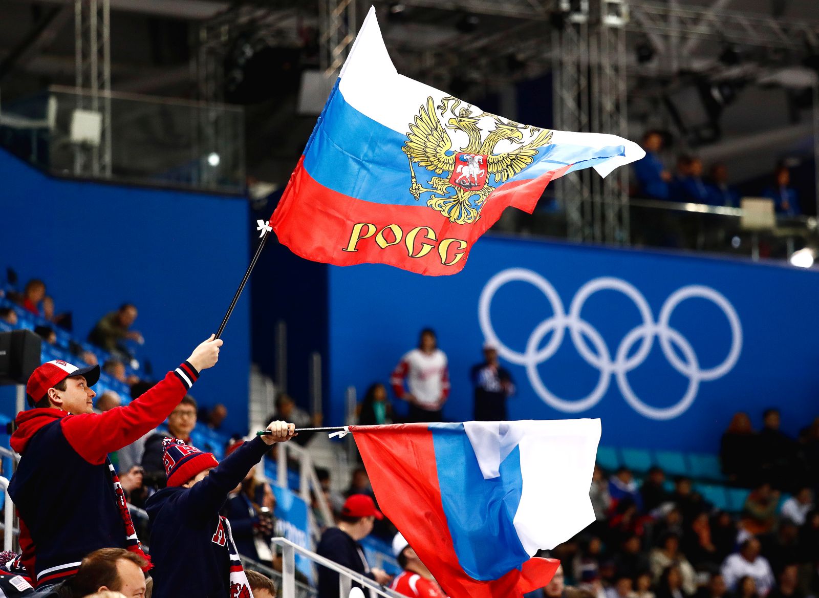 epa09792091 (FILE) - Russian fans wave flags during the men's preliminary round ice hockey match between Russia and the USA inside the Gangneung Hockey Centre at the PyeongChang Winter Olympic Games 2018 in Gangneung, South Korea, 17 February 2018 (re-issued on 28 February 2022). The International Olympic Committee (IOC) on 28 February 2022 recommended that athletes and officials from Russia and Belarus are banned from all international sports competitions.  EPA/LARRY W. SMITH
