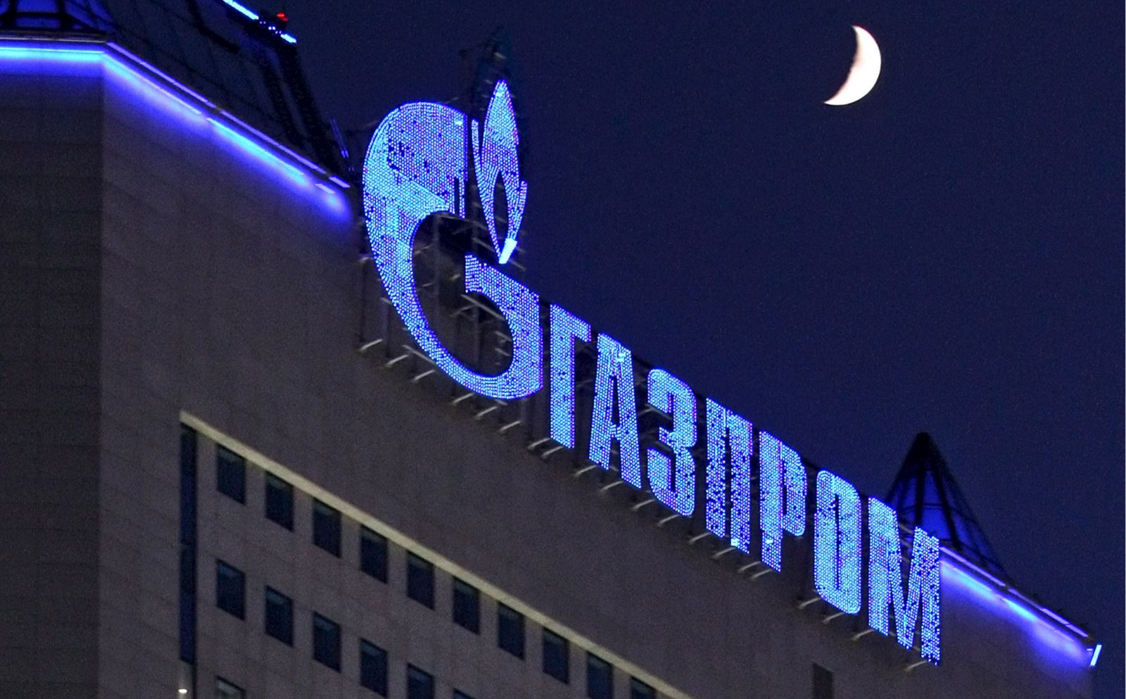 epa09792292 (FILE) - The logo of Russian gas company Gazprom illuminated on Gazprom headquarters in Moscow, Russia, 02 January 2009 (re-issued on 28 February 2022). The European football governing body UEFA announced on 28 February 2022 to have ended its partnership with Gazprom across all competitions. 'The decision -announced UEFA- is effective immediately and covers all existing agreements including the UEFA Champions League, UEFA national team competitions and UEFA EURO 2024'.  EPA/SERGEI ILNITSKY