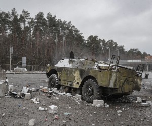 epa09793435 A damaged Ukrainian armored vehicle in the aftermath of an overnight shelling at the Ukrainian checkpoint in Brovary near Kiev (Kyiv), Ukraine, 01 March 2022. Russian troops entered Ukraine on 24 February prompting the country's president to declare martial law and triggering a series of announcements by Western countries to impose severe economic sanctions on Russia.  EPA/SERGEY DOLZHENKO