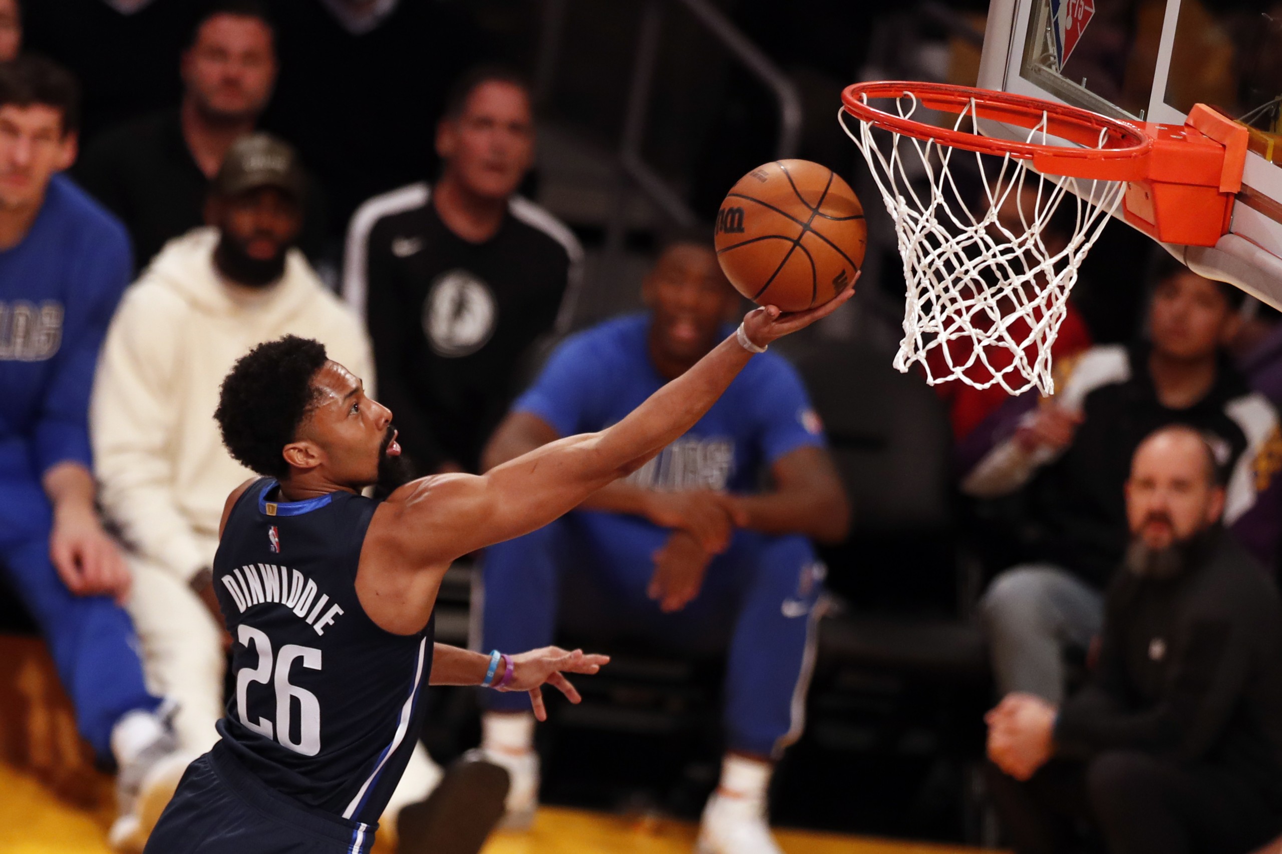 epa09795563 Dallas Mavericks guard Spencer Dinwiddie scores during the first quarter of the NBA basketball game between the Los Angeles Clippers and the Dallas Mavericks at the Crypto.com Arena in Los Angeles, California, USA, 01 March 2022.  EPA/ETIENNE LAURENT SHUTTERSTOCK OUT