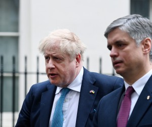 epa09796239 British Prime Minister Boris Johnson (L) and Ukrainian Ambassador Vadym Prystaiko (R) depart 10 Downing Street for Prime Ministers Questions at parliament in London, Britain  02 March 2022.  EPA/ANDY RAIN