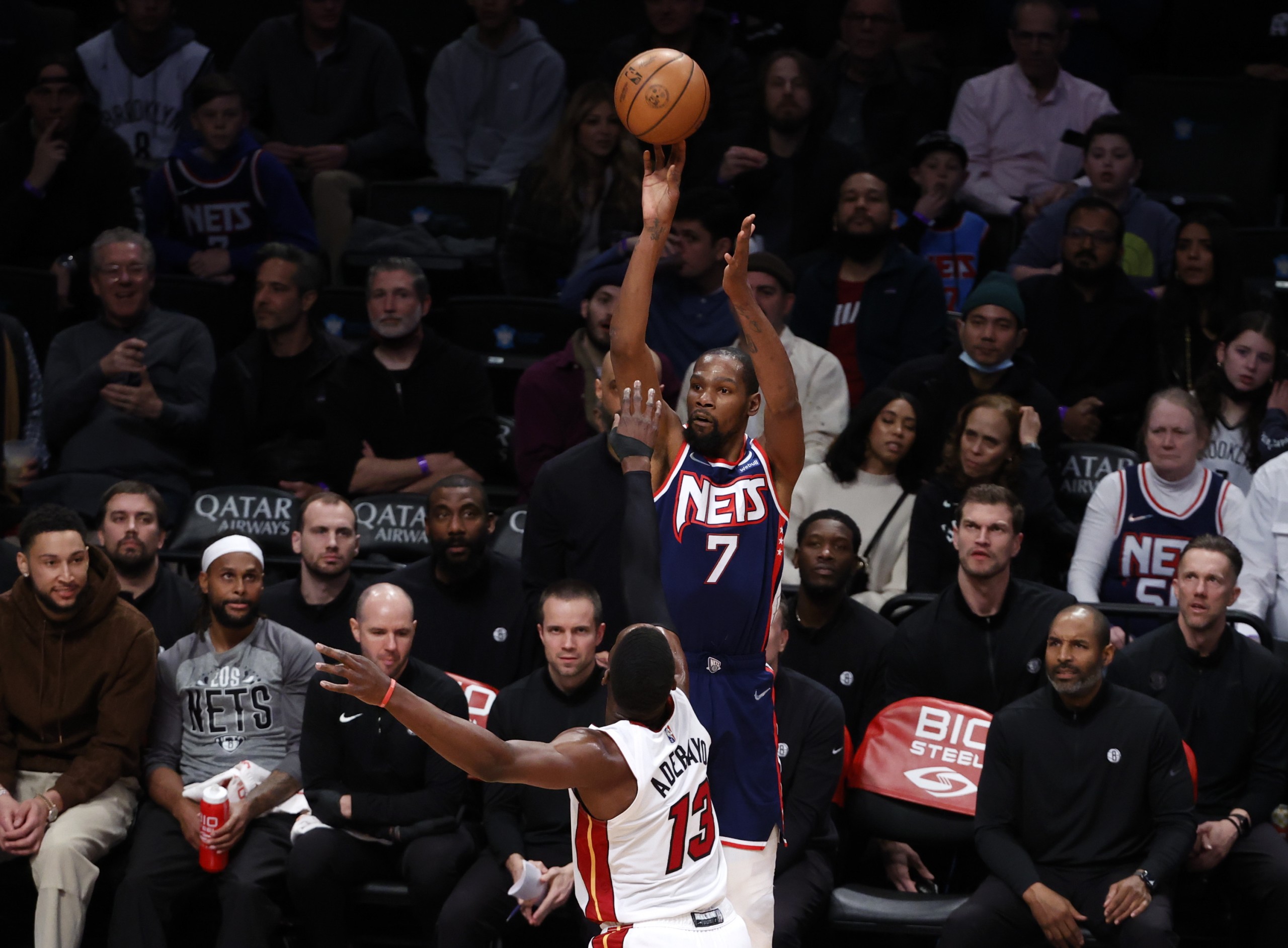 epa09799958 Brooklyn Nets forward Kevin Durant (Top) puts up a shot over a defending Miami Heat center Bam Adebayo (Bottom) during the first half of the NBA basketball game between the Miami Heat and the Brooklyn Nets at the Barclays Center in Brooklyn, New York, USA, 03 March 2022.  EPA/JASON SZENES  SHUTTERSTOCK OUT