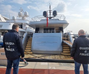 epa09803040 Guardia di Finanza (Italian finance police) officers look at seized maxi yacht 'Lena' in the port of Sanremo, Italy, 05 March 2022. The 52-meter boat with an estimated value of 50 million dollars, is owned by the Russian energy and infrastructure magnate Gennady Timchenko, owner of Volga Group and partner of Novatek. Along with other Russian oligarchs, Timchenko's assets were frozen by the EU on 28 February in response to Russia invading the Ukraine.  EPA/Fabrizio Tenerelli