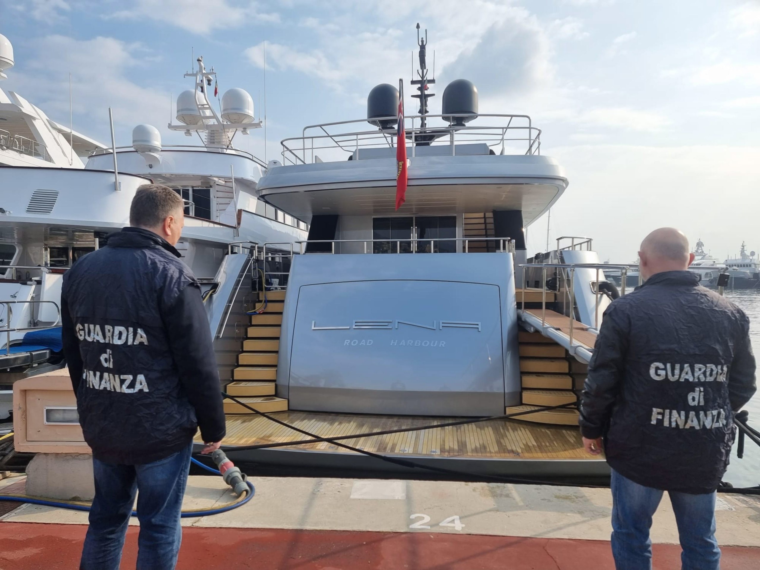 epa09803040 Guardia di Finanza (Italian finance police) officers look at seized maxi yacht 'Lena' in the port of Sanremo, Italy, 05 March 2022. The 52-meter boat with an estimated value of 50 million dollars, is owned by the Russian energy and infrastructure magnate Gennady Timchenko, owner of Volga Group and partner of Novatek. Along with other Russian oligarchs, Timchenko's assets were frozen by the EU on 28 February in response to Russia invading the Ukraine.  EPA/Fabrizio Tenerelli