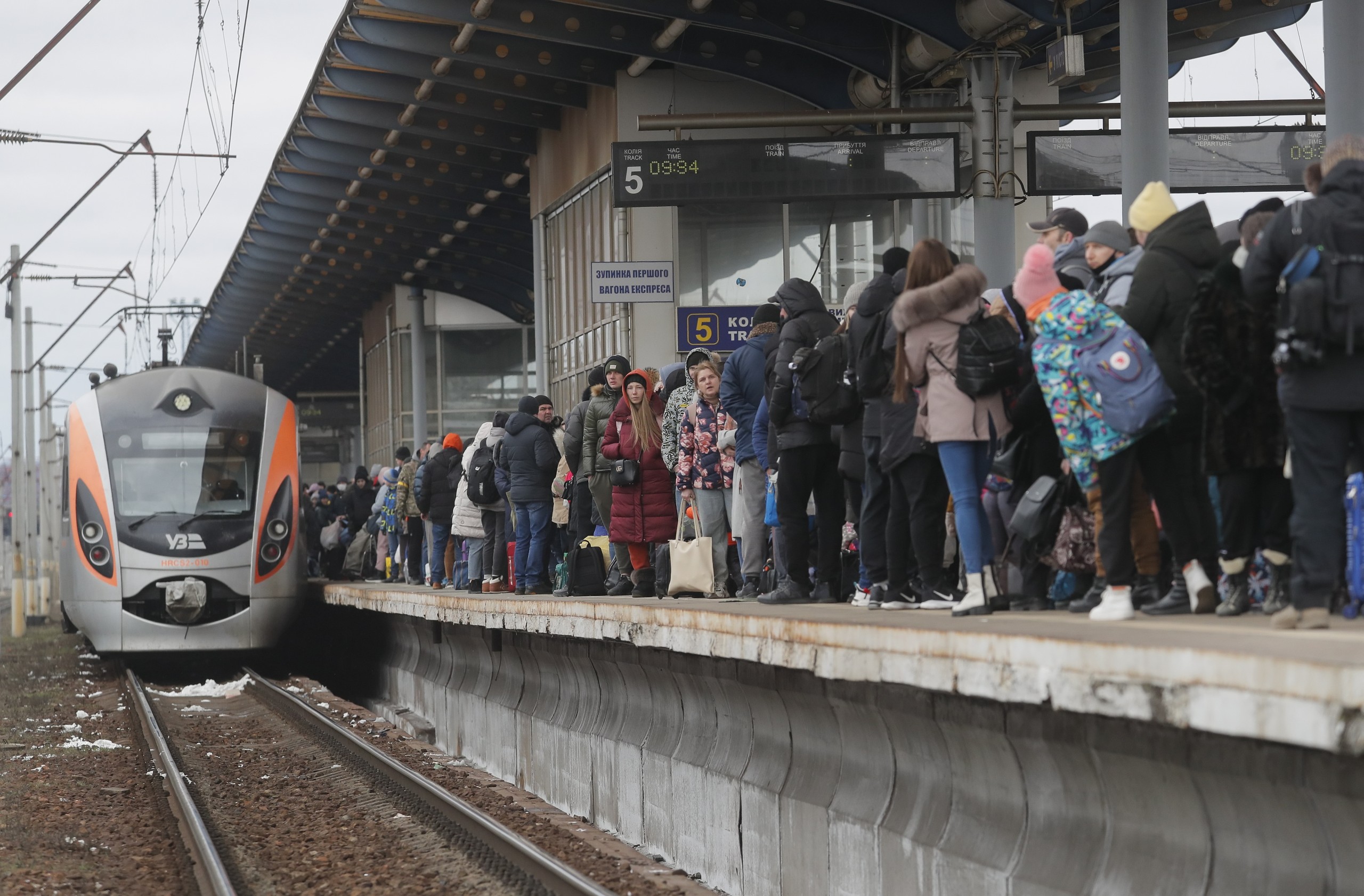epa09803528 People wait for the arrival of an evacuation train at a railway station in Kyiv (Kiev), Ukraine, 05 March 2022. According to the United Nations (UN), at least one million people have fled Ukraine to neighboring countries since the beginning of Russia's military aggression on 24 February 2022. The UN estimates that around 160,000 Ukrainians are currently internally displaced.  EPA/SERGEY DOLZHENKO