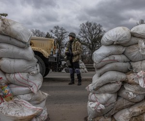 epa09804490 A member of the Territorial Defense Forces stands guard at a checkpoint in the eastern frontline of Kyiv (Kiev) region, Ukraine, 05 March 2022. According to the United Nations (UN), at least one million people have fled Ukraine to neighboring countries since the beginning of Russia's military aggression on 24 February 2022.  EPA/ROMAN PILIPEY