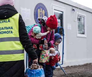 epa09807616 Ukrainian refugees at the refugee camp of Siret, northern Romania, 07 March 2022. Since Russia began its military operation in Ukraine on 24 February, some 261,445 Ukrainian citizen have entered Romania, according to the latest report of the Border Police.  EPA/Jessica Pasqualon