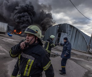 epa09810337 Firefighters in action trying to extinguish the fire at the storage with chemicals which was shelled, on the outskirts of Brovary, the eastern frontline of Kyiv (Kiev) region, Ukraine, 08 March 2022. According to the United Nations High Commissioner for Refugees (UNHCR), Russia's military invasion of Ukraine, which started on 24 February, has destroyed civilian infrastructure and caused civilian casualties, leaving tens of thousands internally displaced and over two million refugees fleeing the country.  EPA/ROMAN PILIPEY