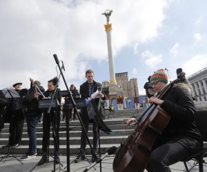 epa09812502 Members of the Kyiv-Classic symphonic orchestra perform demanding to close the sky over Ukraine at the Independence Square in Kyiv (Kiev), Ukraine, 09 March 2022. According to the United Nations High Commissioner for Refugees (UNHCR), Russia's military invasion of Ukraine, which started on 24 February, has caused destruction of civilian infrastructure as well as civilian casualties, with tens of thousands internally displaced and over two million refugees fleeing Ukraine.  EPA/ZURAB KURTSIKIDZE