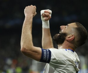 epa09813697 Real Madrid's Karim Benzema celebrates after scoring the 2-1 lead during the UEFA Champions League round of 16, second leg soccer match between Real Madrid and Paris Saint-Germain (PSG) in Madrid, Spain, 09 March 2022.  EPA/Juanjo Martin