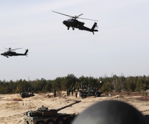epa09817851 US combat helicopters AH-64 Apache and tanks during the international military exercise Crystal Arrow 22, organized by Mechanized Infantry Brigade of the Latvian Land Forces in Adazi training ground, Latvia, 11 March 2022. The purpose of the force demonstration is to demonstrate the interoperability of multinational units in various operations and to demonstrate NATO's combat capabilities for the protection of any member of the Alliance. With the conclusion of the Crystal Arrow 2022 exercise, the certification process of the NATO Extended Presence Battlegroup in Latvia is being successfully completed.  EPA/TOMS KALNINS
