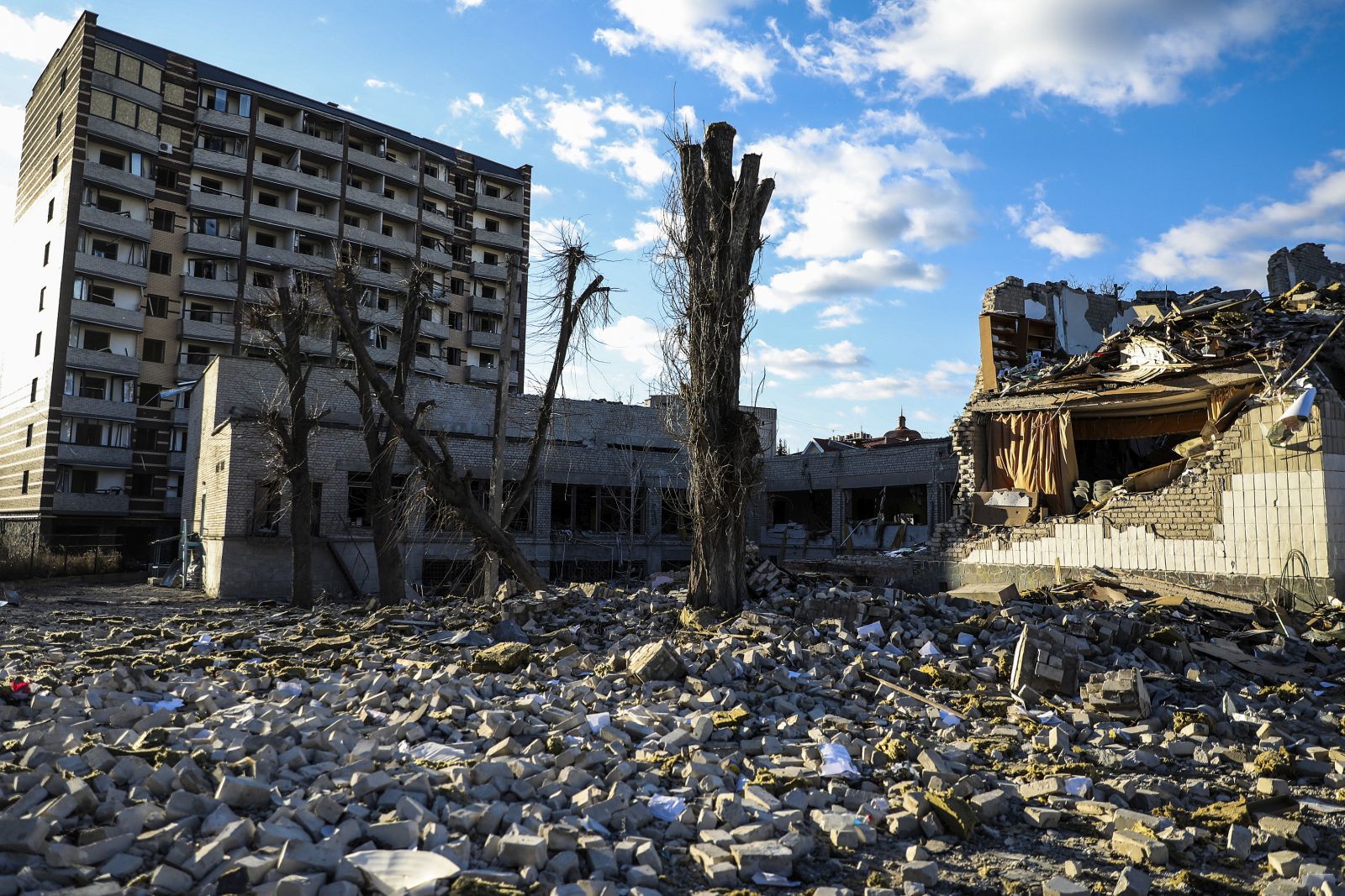 epa09818273 A building that was destroyed by a bomb  near the school number 25 in Zhytomyr, Ukraine, 11 March 2022. According to the United Nations refugee agency UNHCR, over 2.5 million people have fled Ukraine since the Russian invasion began on 24 February. Many, however, have decided to stay and fight.  EPA/MIGUEL A. LOPES
