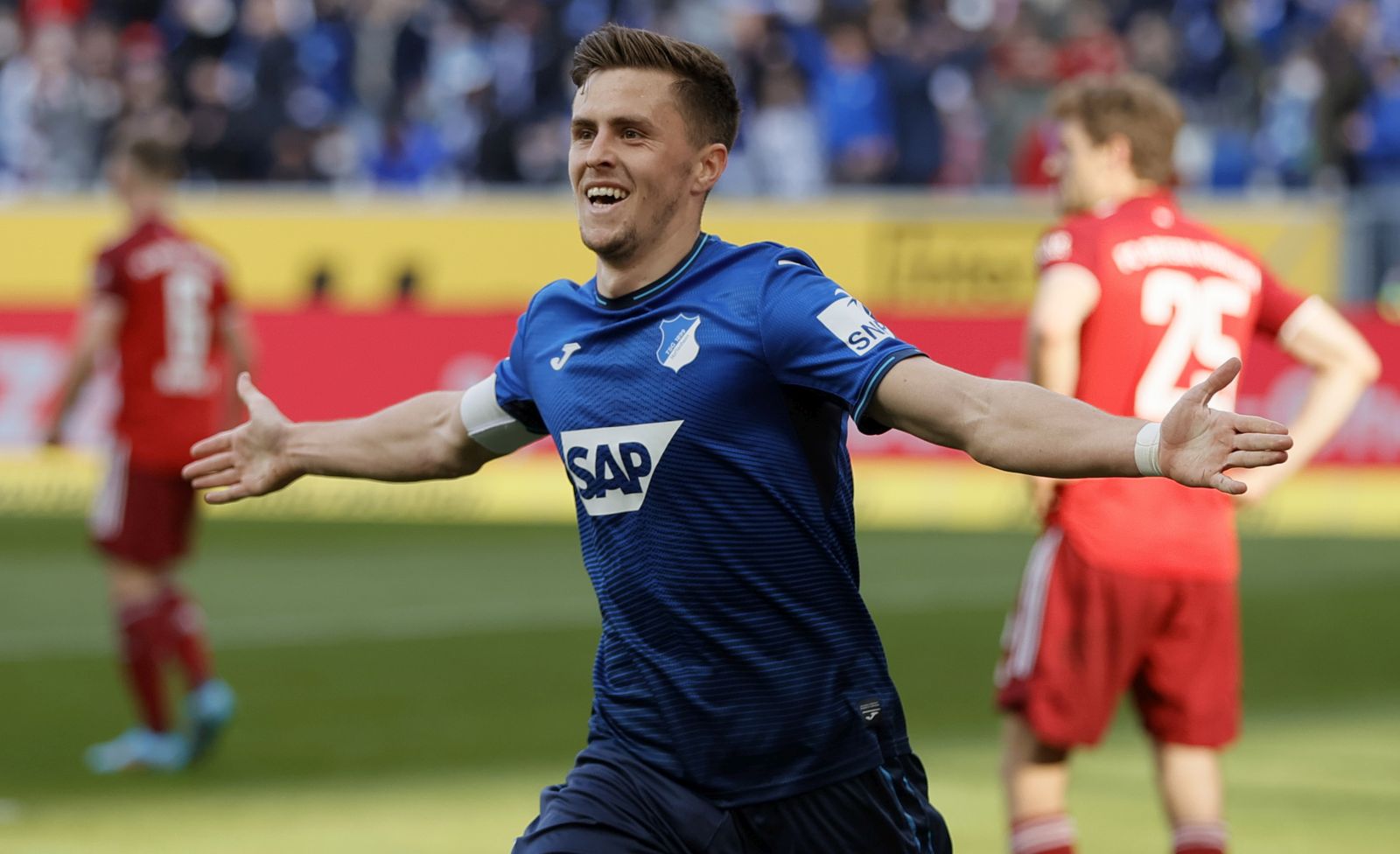epa09819173 Hoffenheim's Christoph Baumgartner celebrates after scoring the opening goal during the German Bundesliga soccer match between TSG 1899 Hoffenheim and FC Bayern Munich in Sinsheim, Germany, 12 March 2022.  EPA/RONALD WITTEK CONDITIONS - ATTENTION: The DFL regulations prohibit any use of photographs as image sequences and/or quasi-video.