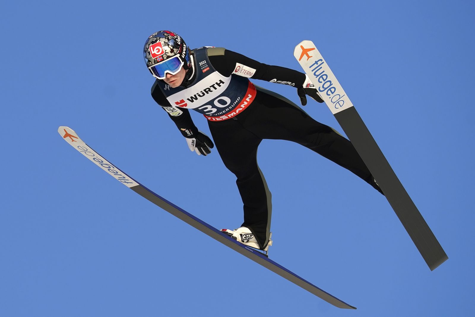 epa09819364 Marius Lindvik of Norway is airborne during the Men's HS240 competition at the FIS Ski Jumping World Cup in Vikersund, Norway, 12 March 2022.  EPA/Terje Bendiksby  NORWAY OUT