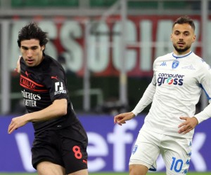epa09819868 AC Milan’s Sandro Tonali (L) challenges for the ball  with Empoli’s Nedim Bajrami during the Italian Serie A soccer match between AC Milan and Empoli at Giuseppe Meazza stadium in Milan, Italy, 12 March 2022.  EPA/MATTEO BAZZI