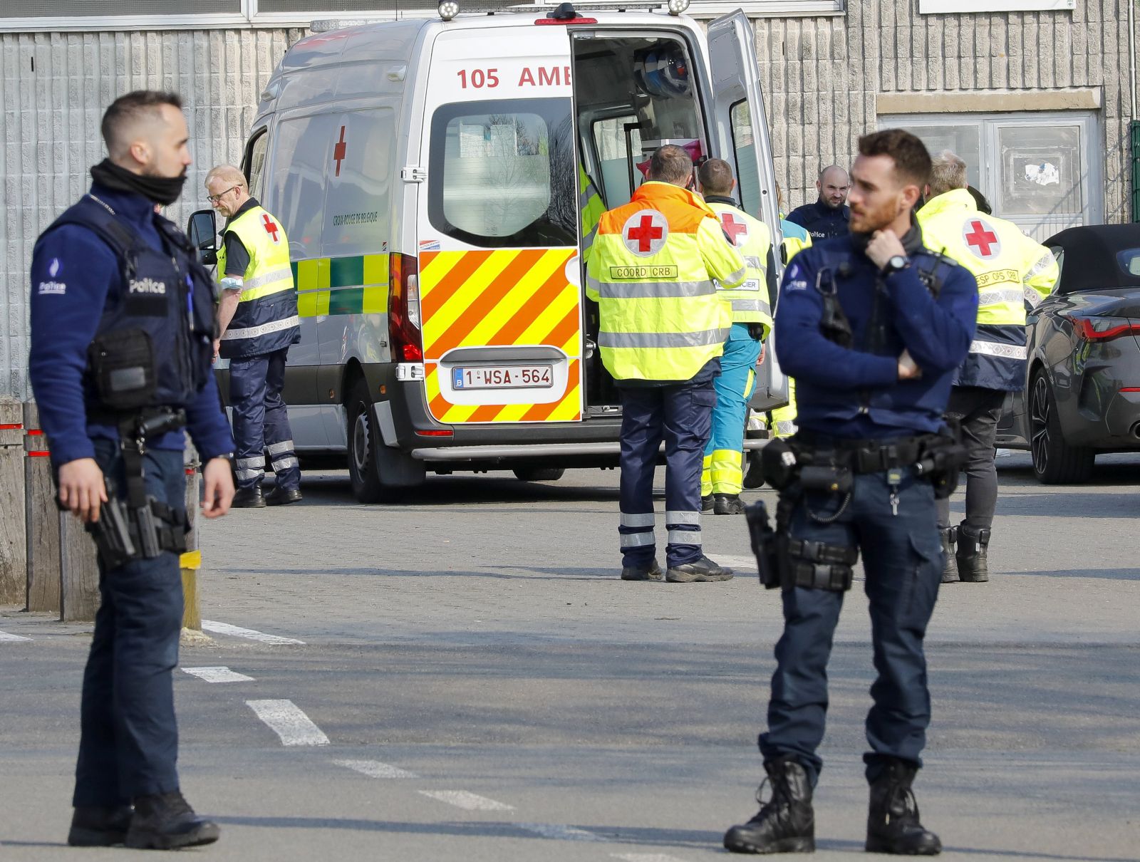 epa09837571 Police officers stand guard at the cordoned off scene in Strepy Bracquegnies, Belgium, 20 March 2022. Six people lost their lives and 26 were injured in the morning, when a car rammed in a carnival crowd.  EPA/JULIEN WARNAND