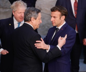 epa09845815 (L-R) Britain's Prime Minister Boris Johnson,  Italian Prime Minister Mario Draghi and French President Emmanuel Macron talk during a family picture during an extraordinary NATO Summit at the Alliance headquarters in Brussels, Belgium, 24 March 2022. NATO leaders will address the consequences of Russian President Putin's invasion of Ukraine, discuss the role of China in this crisis, and decide on the next steps to strengthen NATO's deterrence and defence.  EPA/STEPHANIE LECOCQ