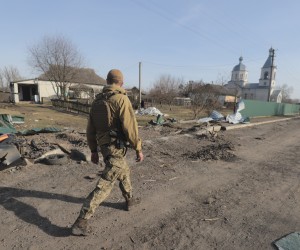 epa09856851 A Ukrainian soldier walks on a street after fighting, in an area now released from Russian troops, not far from Kyiv (Kiev), Ukraine, 28 March 2022. On 24 February, Russian troops entered Ukrainian territory in what the Russian president declared a 'special military operation', resulting in fighting and destruction in the country, a huge flow of refugees, and multiple sanctions against Russia.  EPA/STR