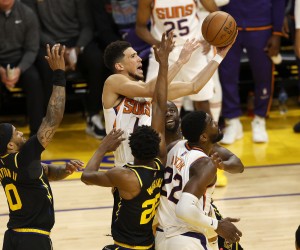 epa09861327 Phoenix Suns guard Devin Booker (C) goes to the basket for two points against the Golden State Warriors during the second half of their NBA game at Chase Center in San Francisco, California, USA, 30 March 2022.  EPA/JOHN G. MABANGLO SHUTTERSTOCK OUT
