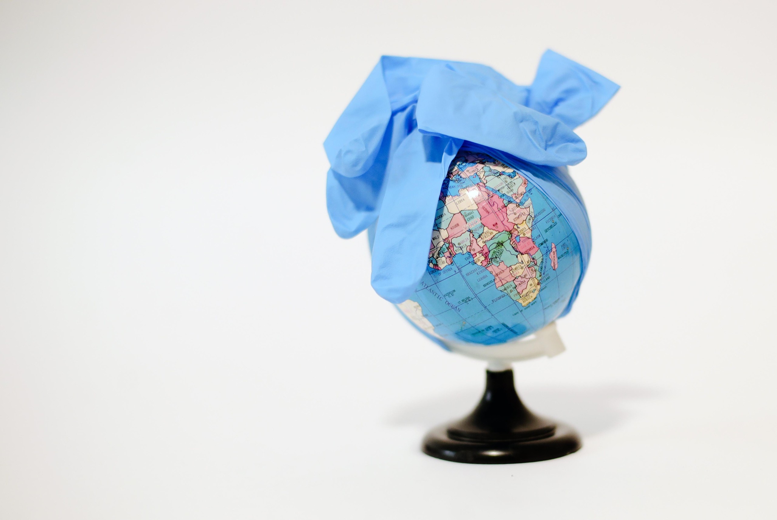09.10.2021., Zagreb - Ilustracija. Plasticna rukavica na mini globusu simbolizira ilustracija za svjetsku pandemiju koronavirusa. Photo: Sanjin Strukic/PIXSELL