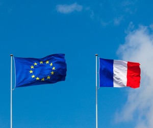 EU flag and France flag are on blue sky. Concept relations between Europe and France