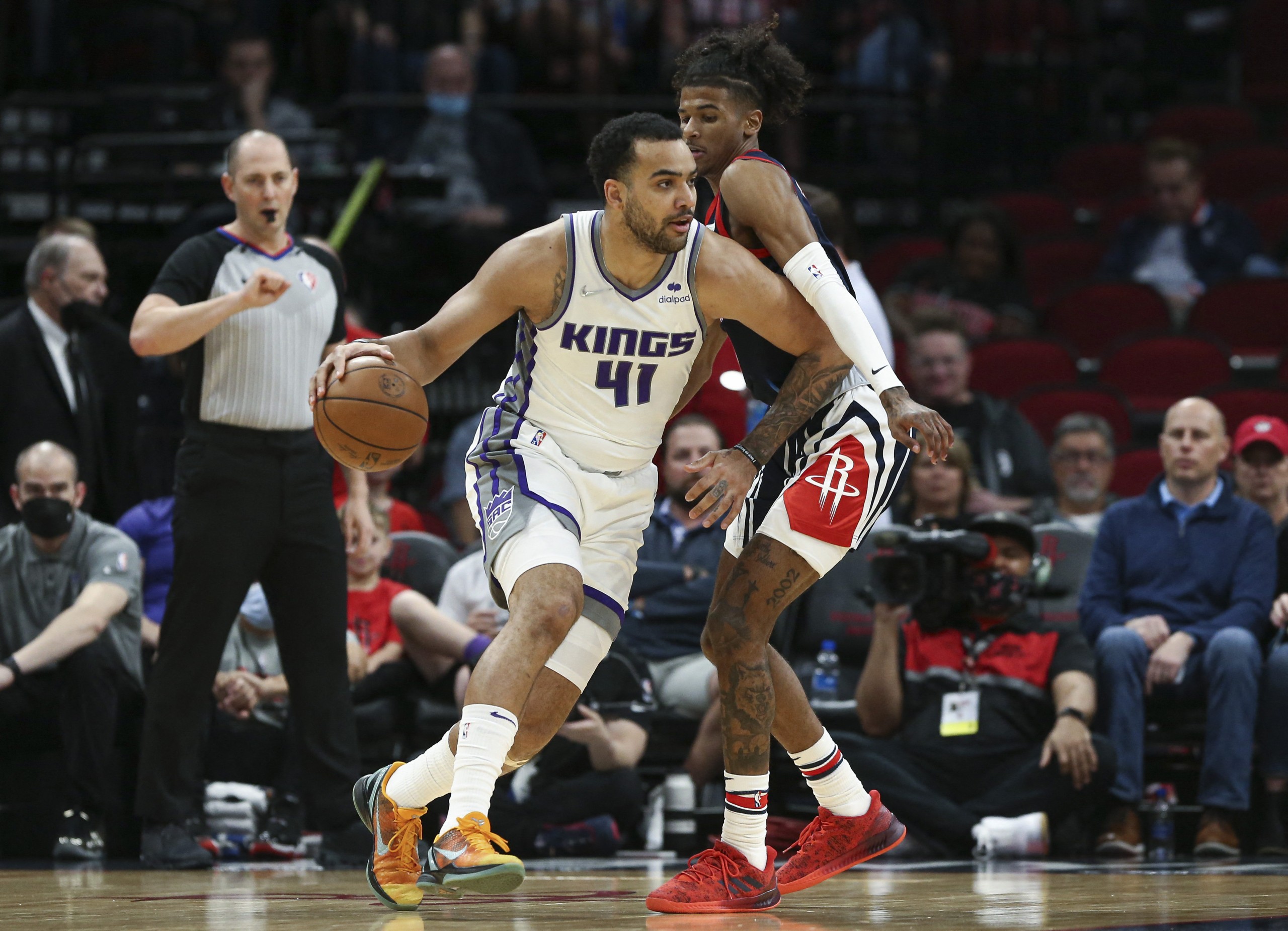 Apr 1, 2022; Houston, Texas, USA; Sacramento Kings forward Trey Lyles (41) drives with the ball as Houston Rockets guard Jalen Green (0) defends during the first quarter at Toyota Center. Mandatory Credit: Troy Taormina-USA TODAY Sports