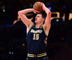 Apr 3, 2022; Los Angeles, California, USA; Denver Nuggets center Nikola Jokic (15) shoots against the Los Angeles Lakers during the first half at Crypto.com Arena. Mandatory Credit: Gary A. Vasquez-USA TODAY Sports