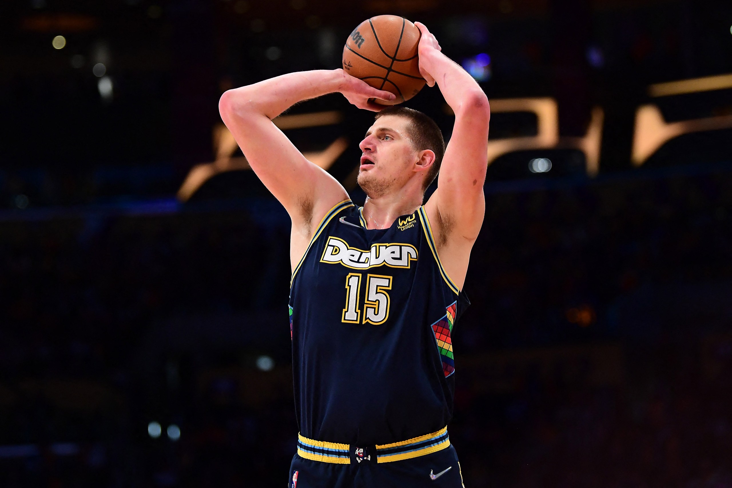 Apr 3, 2022; Los Angeles, California, USA; Denver Nuggets center Nikola Jokic (15) shoots against the Los Angeles Lakers during the first half at Crypto.com Arena. Mandatory Credit: Gary A. Vasquez-USA TODAY Sports