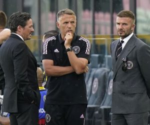 David Beckham, owner and president of soccer operations for Inter Miami, right, talks with head coach Phil Neville, center, and David Gardner, left, before an MLS soccer match between Inter Miami and CF Montréal, Wednesday, May 12, 2021, in Fort Lauderdale, Fla. (AP Photo/Lynne Sladky)