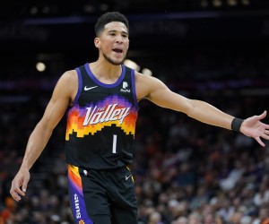 Phoenix Suns guard Devin Booker (1) looks for a call during the first half of Game 2 of an NBA basketball first-round playoff series against the New Orleans Pelicans, Tuesday, April 19, 2022, in Phoenix. (AP Photo/Matt York)