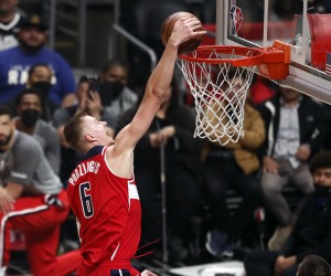epa09814005 Washington Wizards forward-center Kristaps Porzingis scores during the first quarter of the NBA basketball game between the Los Angeles Clippers and the Washington Wizards at the Crypto.com Arena in Los Angeles, California, USA, 09 March 2022.  EPA/ETIENNE LAURENT SHUTTERSTOCK OUT