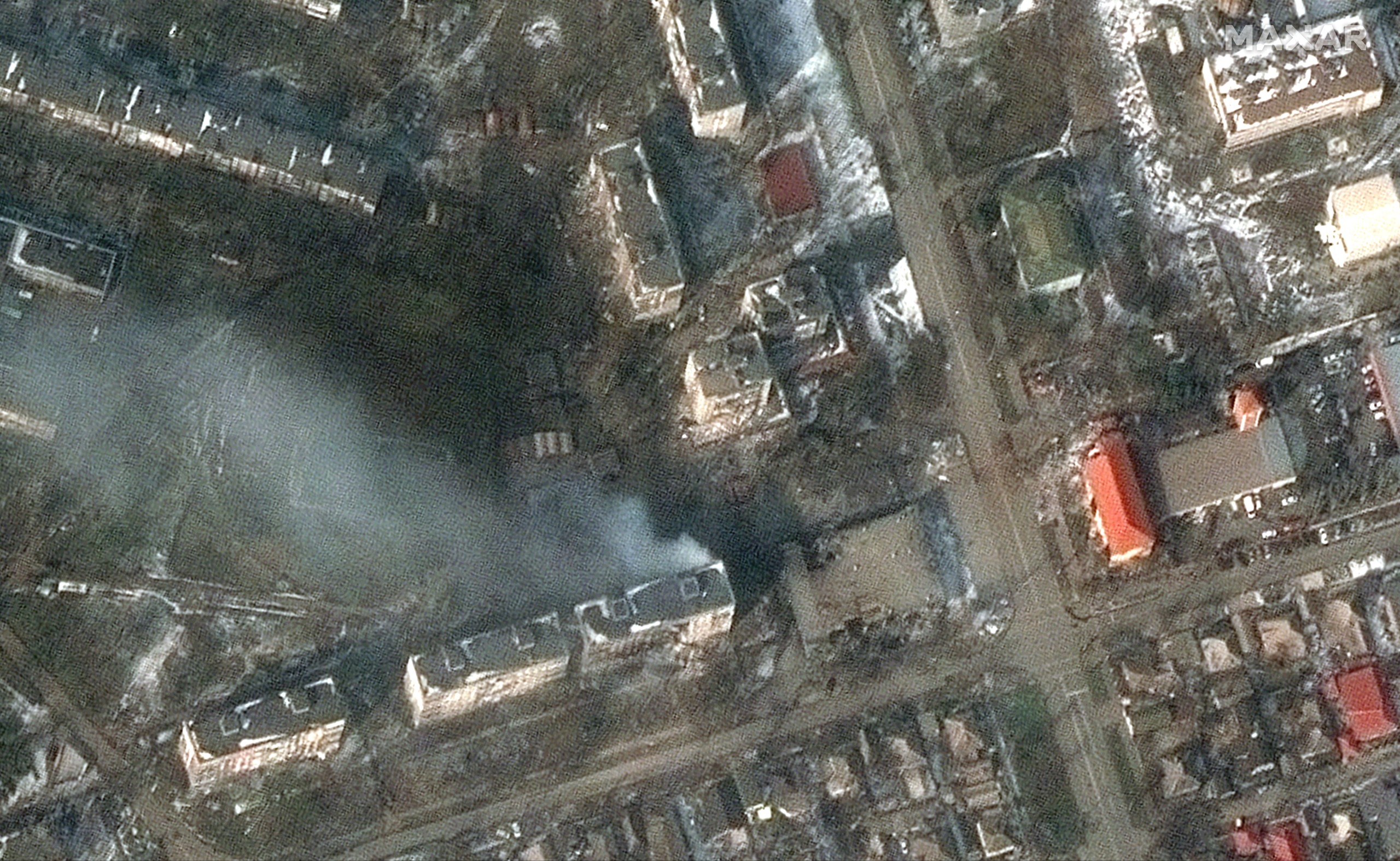 epa09820163 A handout satellite image made available by Maxar Technologies shows views of apartment buildings and damage, Zelinskovo Street, in Mariupol, Ukraine, 12 March 2022.  EPA/MAXAR TECHNOLOGIES HANDOUT -- MANDATORY CREDIT: SATELLITE IMAGE 2022 MAXAR TECHNOLOGIES -- THE WATERMARK MAY NOT BE REMOVED/CROPPED -- HANDOUT EDITORIAL USE ONLY/NO SALES HANDOUT EDITORIAL USE ONLY/NO SALES