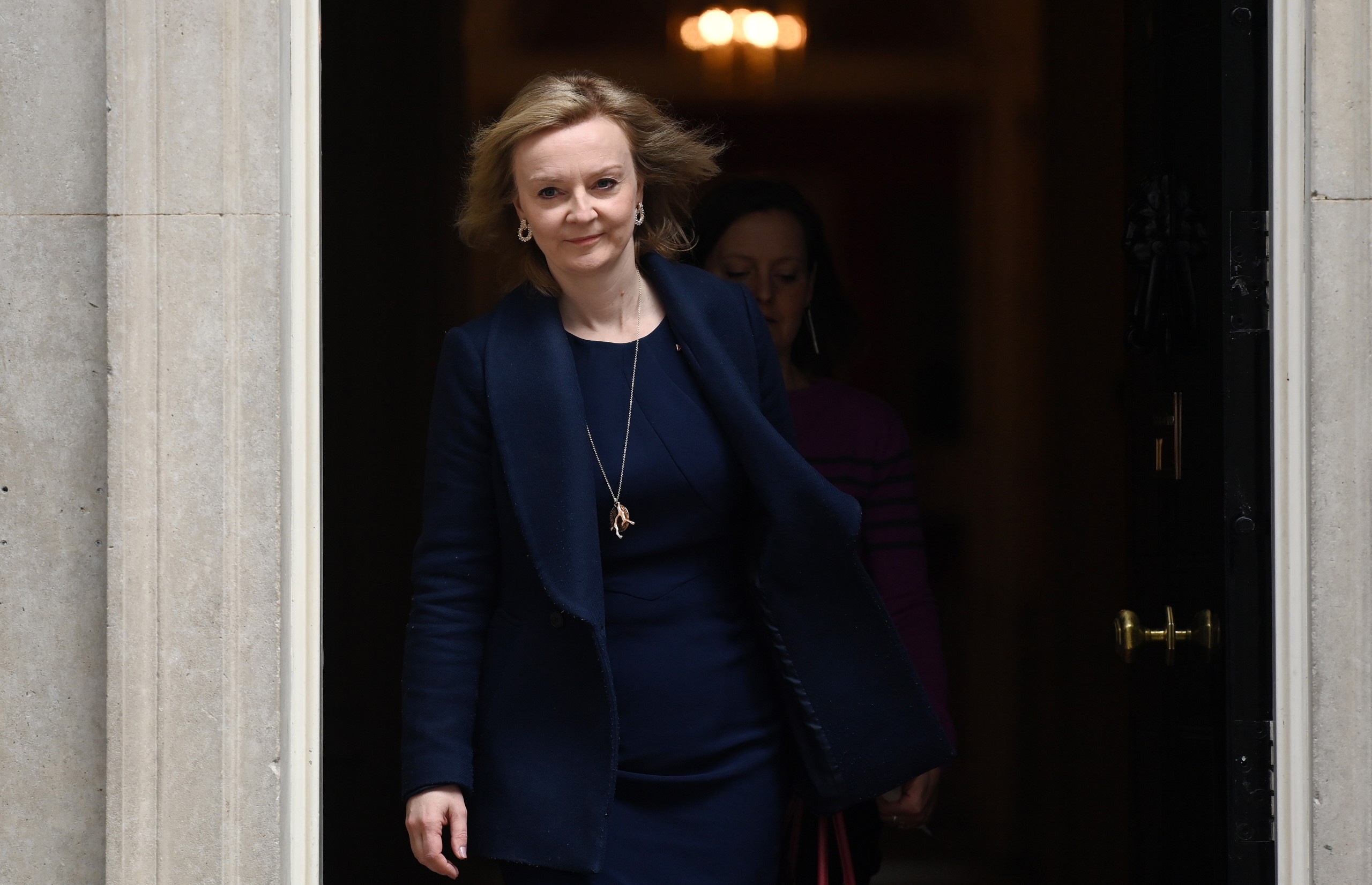 epa09855941 British Foreign Secretary Lizz Truss departs 10 Downing Street, following a meeting with British Prime Minister Boris Johnson in London, Britain, 28 March 2022. Truss held meetings with British PM Boris Johnson and Admiral Sir Tony Radakin, head of the United Kingdom's Armed Forces.  EPA/ANDY RAIN