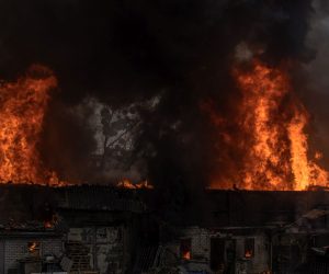 epa09856400 The fire and smoke comes from a warehouse that was hit by the Russian artillery shelling, in Kharkiv, northeast Ukraine, 28 March 2022. Kharkiv, Ukraine’s second-largest city of 1.5 million people, which lies about 25 miles from the Russian border, has been heavily shelled by Russian forces over the past weeks, with many civilians killed in the city.  EPA/ROMAN PILIPEY