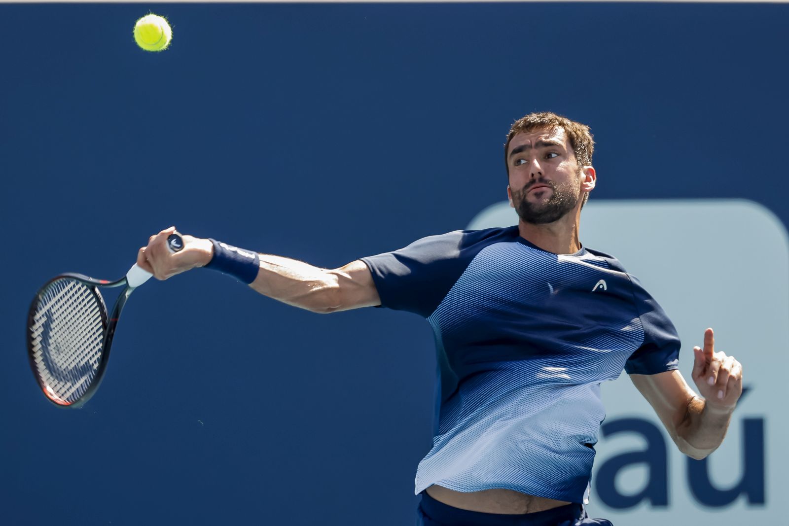 epa09856825 Marin Cilic of Croatia in action against Carlos Alcaraz of Spain  during a third round match of the Miami Open tennis tournament at Hard Rock Stadium in Miami Gardens, Florida, USA, 28 March 2022.  EPA/ERIK S. LESSER
