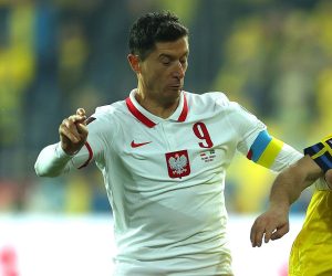 epa09859037 Poland's Robert Lewandowski (L) in action against Sweden's Jesper Karlstrom (R) during the FIFA World Cup 2022 playoff qualifying soccer match between Poland and Sweden in Chorzow, Poland, 29 March 2022.  EPA/LUKASZ GAGULSKI POLAND OUT