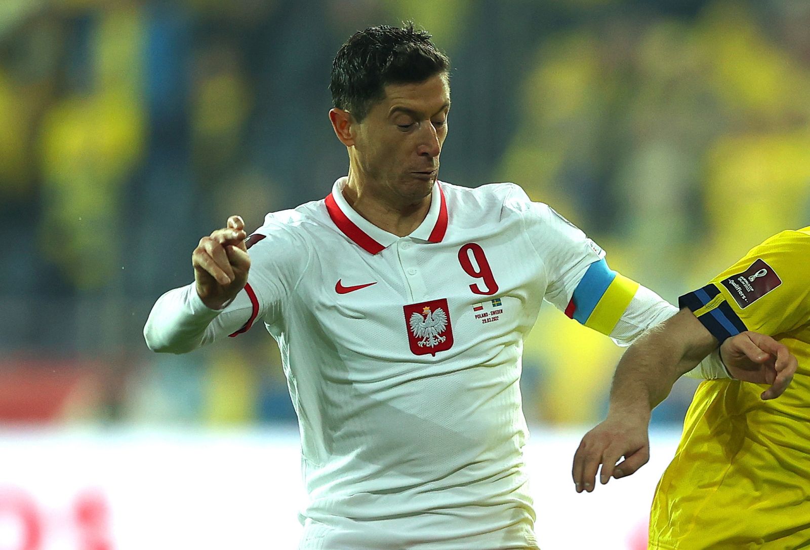 epa09859037 Poland's Robert Lewandowski (L) in action against Sweden's Jesper Karlstrom (R) during the FIFA World Cup 2022 playoff qualifying soccer match between Poland and Sweden in Chorzow, Poland, 29 March 2022.  EPA/LUKASZ GAGULSKI POLAND OUT