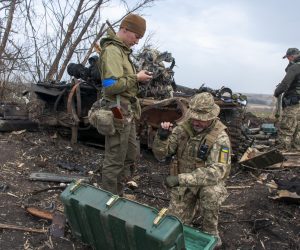 epa09863663 Ukrainian soldiers inspect destroyed Russian positions in the recaptured by the Ukrainian army Mala Rohan village, near Kharkiv, northeast Ukraine, 01 April 2022. Mala Rohan and the area around had recently been recaptured by the Ukrainian army from Russian forces. On 24 February Russian troops had entered Ukrainian territory in what the Russian president declared a 'special military operation', resulting in fighting and destruction in the country, a huge flow of refugees, and multiple sanctions against Russia.  EPA/VASILIY ZHLOBSKY