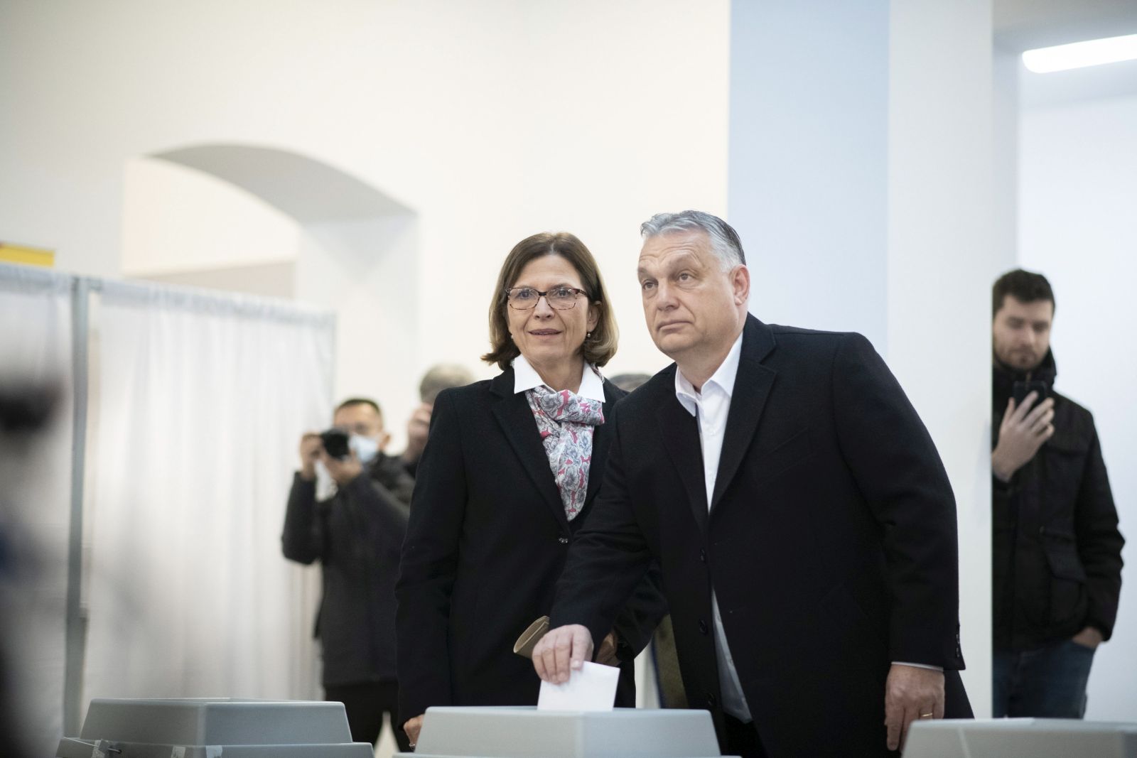 epa09867719 A handout photo made available by the Hungarian PM's Press Office shows Hungarian Prime Minister Viktor Orban (R) and his wife, Aniko Levai (L) cast their vote for the general election and national referendum on the child protection law, in Budapest, Hungary, 03 April 2022.  EPA/BENKO VIVIEN CHER / HUNGARIAN PM PRESS OFFICE HANDOUT  HANDOUT EDITORIAL USE ONLY/NO SALES