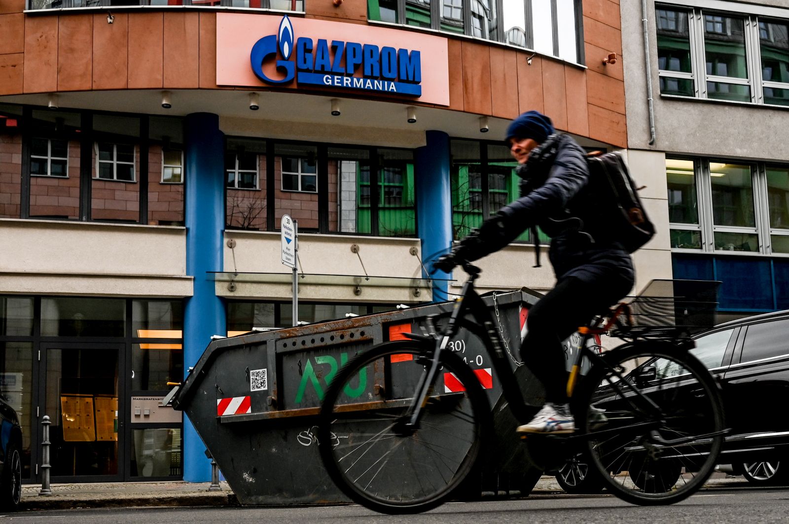 epa09872273 A cyclist passes by Gazprom headquarters in Berlin, Germany, 05 April 2022. German Federal Network Agency on 04 April announced that it has taken over control of Russian gas company German subsidiary Gazprom Germania. The Agency will be used as a trustee until 30 September to ensure proper management of the company.  EPA/FILIP SINGER