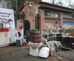 epa09877911 Pieces of furniture and appliances symbolizing those that Russian soldiers allegedly displayed as trophies outside apartments in occupied Ukrainian territories, sit spattered in red paint on the street outside the Consulate of the Russian Federation during an act of protest called 'The second army in the world is robbers and marauders', in Lviv, Ukraine, 08 April 2022.  EPA/MYKOLA TYS