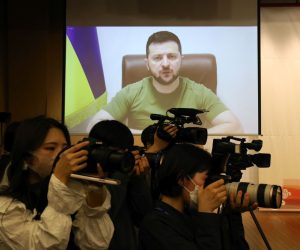 epa09884202 Ukrainian President Volodymyr Zelensky addresses the South Korean parliamentary via video link at the National Assembly in Seoul, South Korea, 11 April 2022. Zelensky has been making a virtual world tour in recent weeks, lobbying foreign governments by video to help Ukraine defend itself against Russia's invasion.  EPA/Chung Sung-Jun / POOL