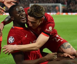 epa09888561 Liverpool's Ibrahima Konate (L) celebrates with teammate Kostas Tsimikas after scoring the 1-0 goal during the UEFA Champions League quarter final, second leg soccer match between Liverpool FC and Benfica Lisbon in Liverpool, Britain, 13 April 2022.  EPA/PETER POWELL
